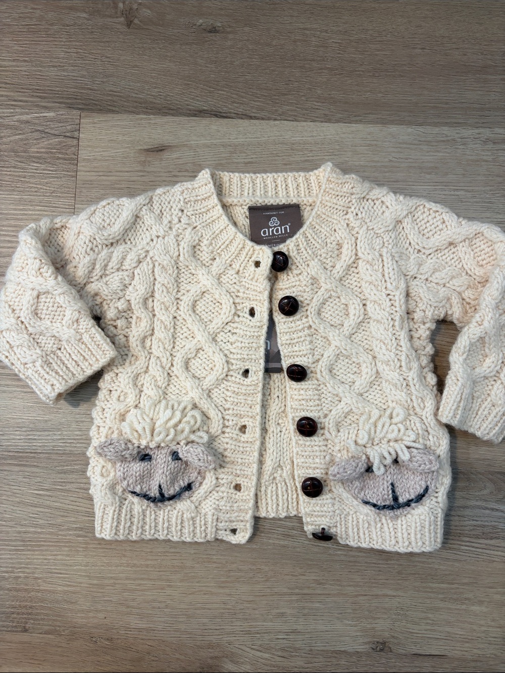 Aran Crafts Cream Knit Baby Cardigan with Sheep Pockets
